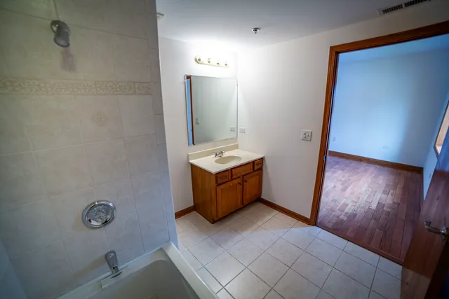 a bathroom with a sink a toilet and mirror