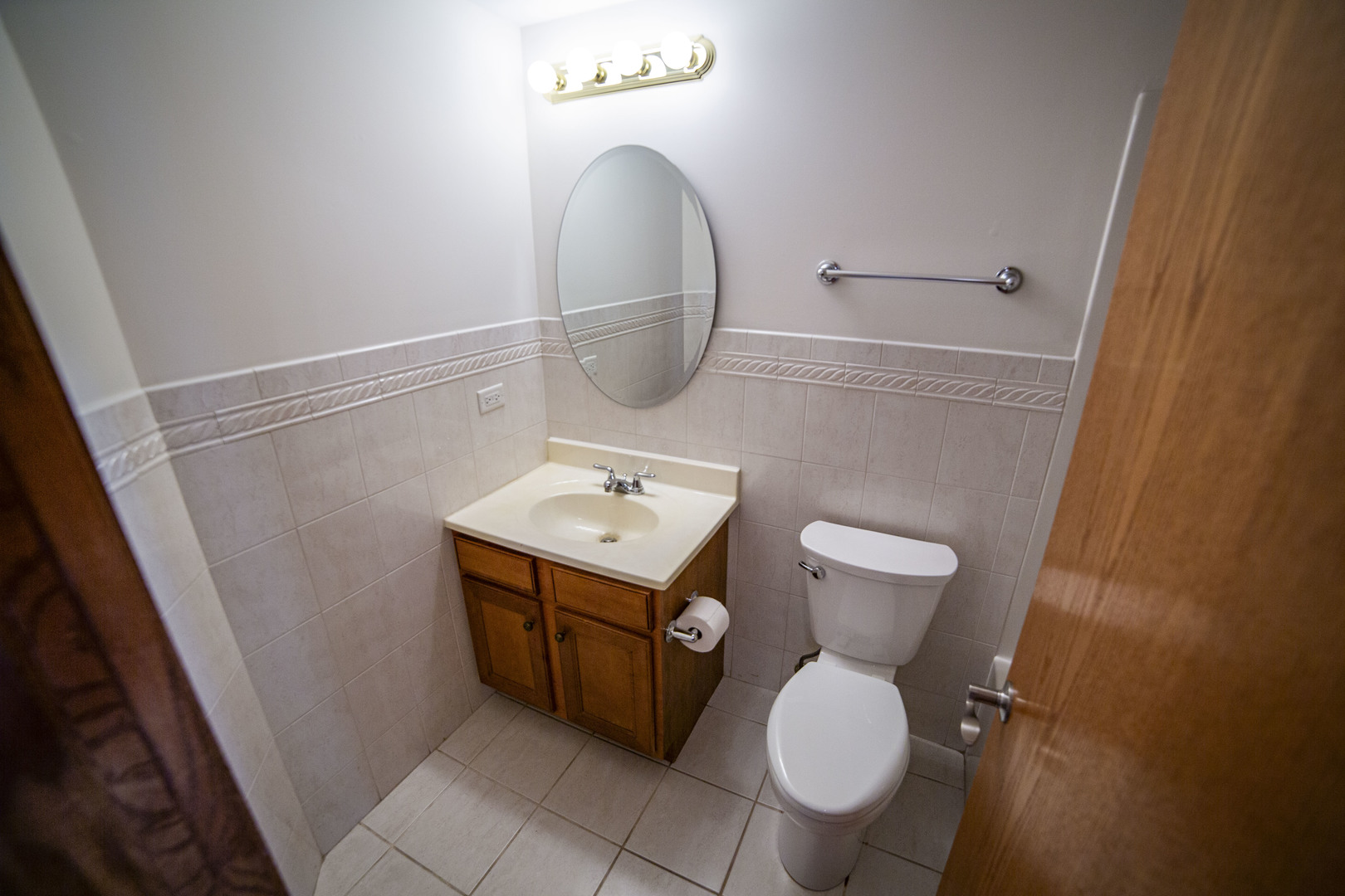 5368 West 96th Street, Unit 2S Oak Lawn, IL 60453 - Photo 10 of 18 a bathroom with a toilet sink and mirror