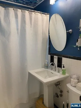 a bathroom with a sink and mirror