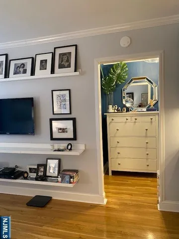 a room with a furniture and flat screen tv