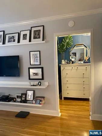 a view of living room with furniture and flat screen tv