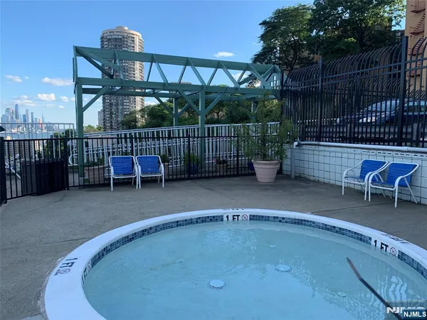 a view of a chairs and table in the patio