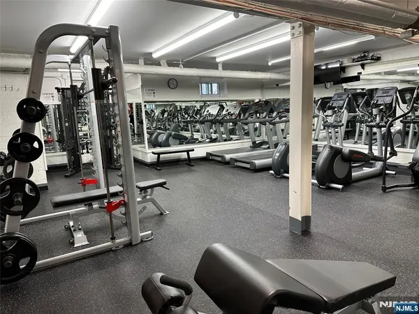 a living room with a couch and a stove top oven