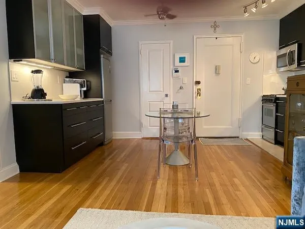 a room with wooden floor and furniture