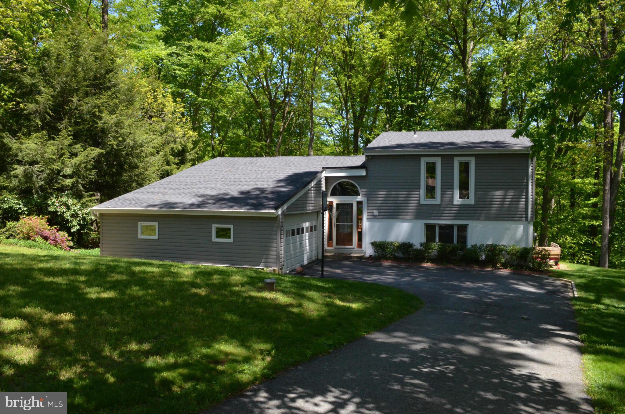 1700 Abelia Road Fallston, MD 21047 - Photo 1 of 30 a front view of a house with a garden