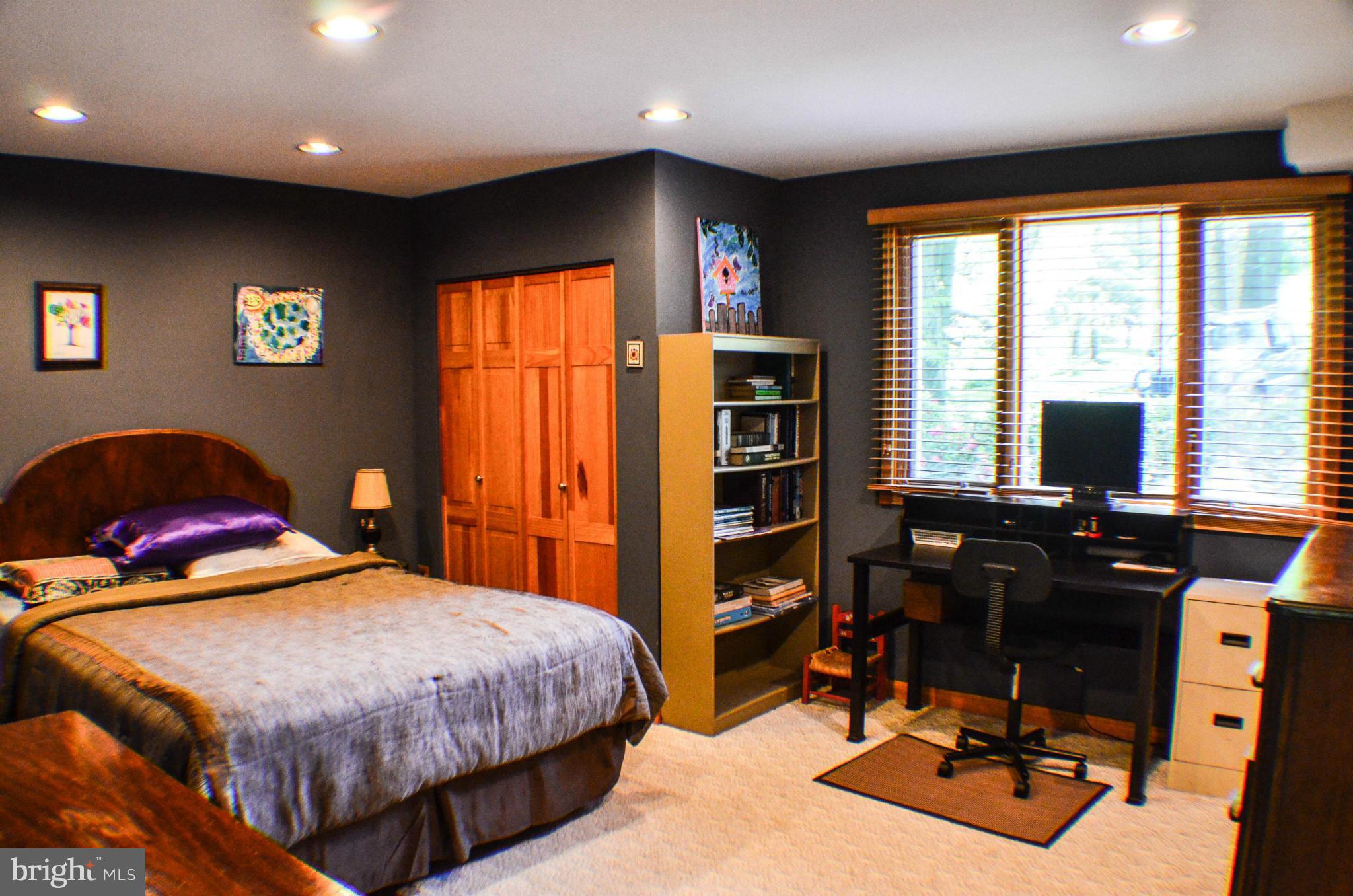 1700 Abelia Road Fallston, MD 21047 - Photo 13 of 30 a bedroom with a large bed and a flat tv screen