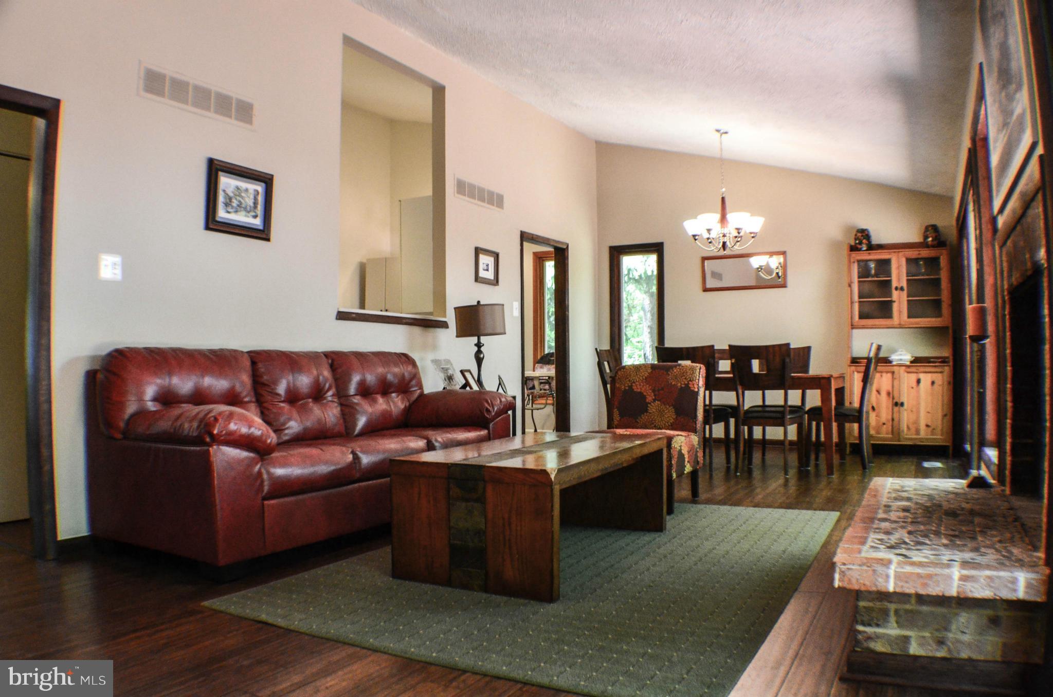 1700 Abelia Road Fallston, MD 21047 - Photo 3 of 30 a living room with furniture wooden floor and a view of kitchen