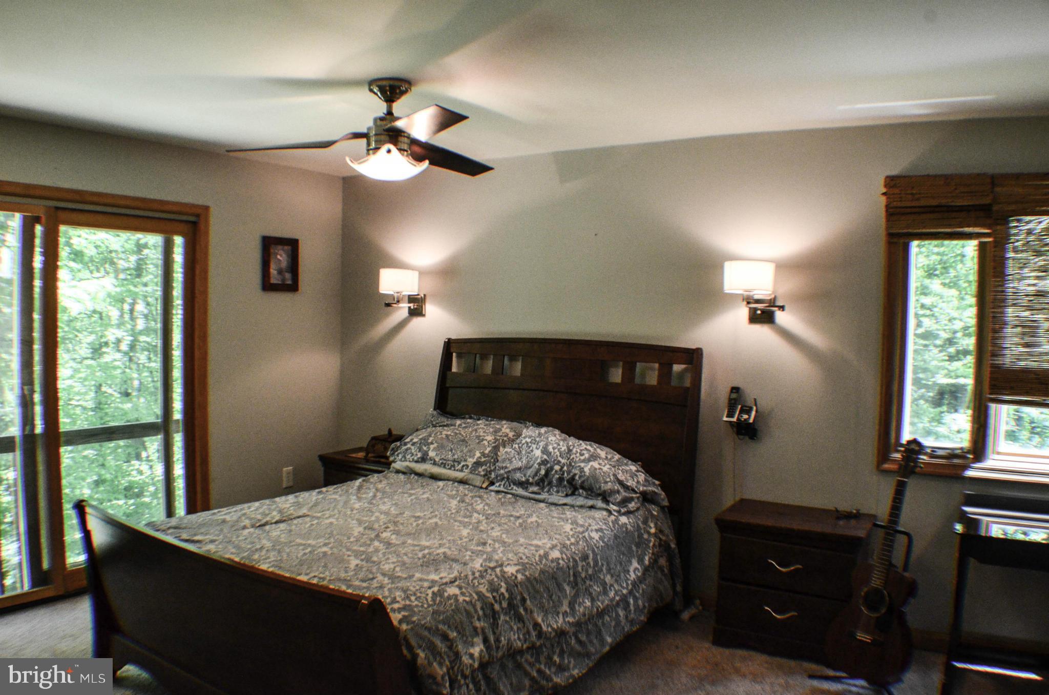 1700 Abelia Road Fallston, MD 21047 - Photo 22 of 30 a bedroom with a bed and a chandelier