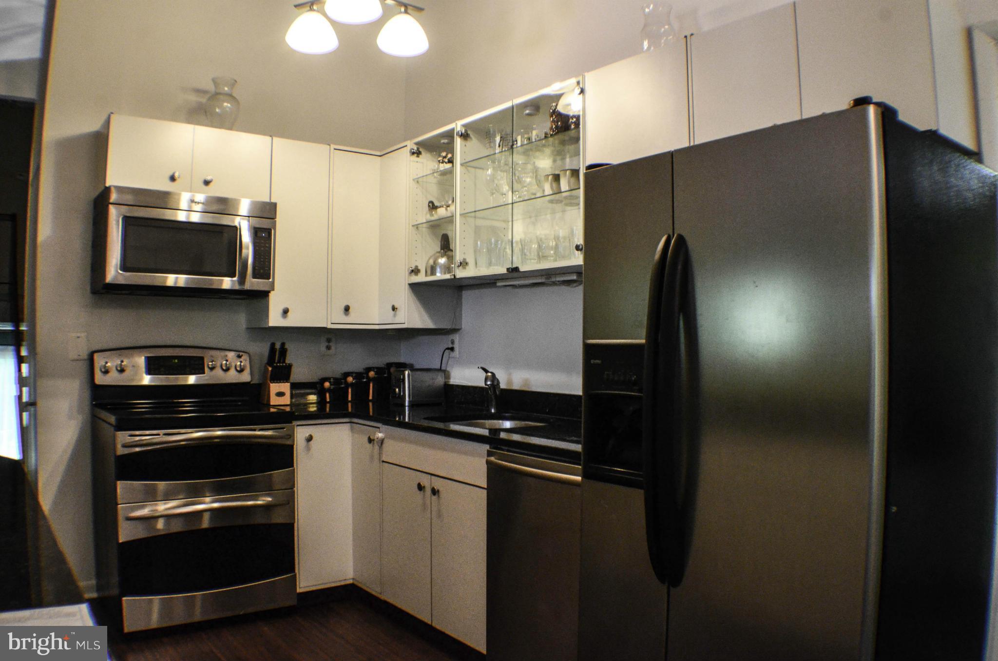 1700 Abelia Road Fallston, MD 21047 - Photo 9 of 30 a kitchen with stainless steel appliances and refrigerator