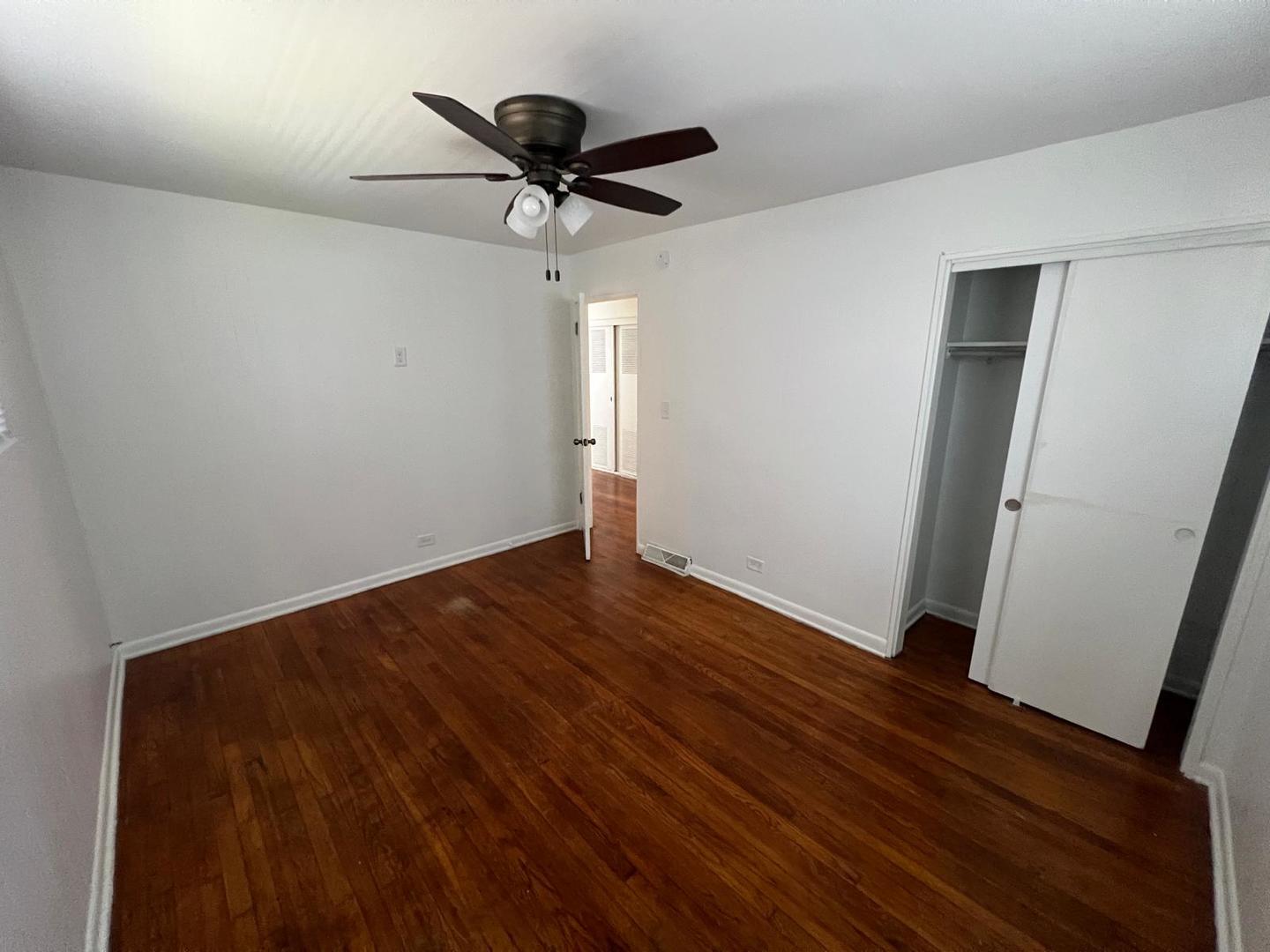 16442 Honore Avenue Markham, IL 60428 - Photo 5 of 16 a view of empty room with wooden floor