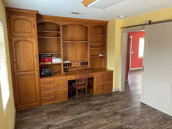 a kitchen with stainless steel appliances a refrigerator and cabinets