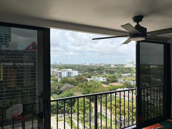 a view of a balcony with two chairs and a table