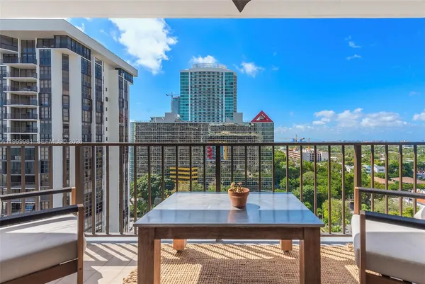a bathroom with a sink a mirror and shower