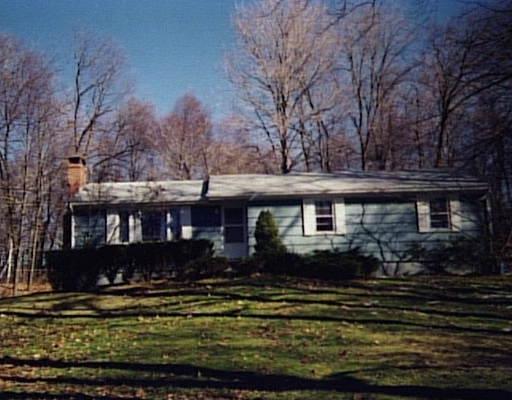 257 Cornwall Road Warren, CT 06754 - Photo 1 of 1 a front view of a house with a yard