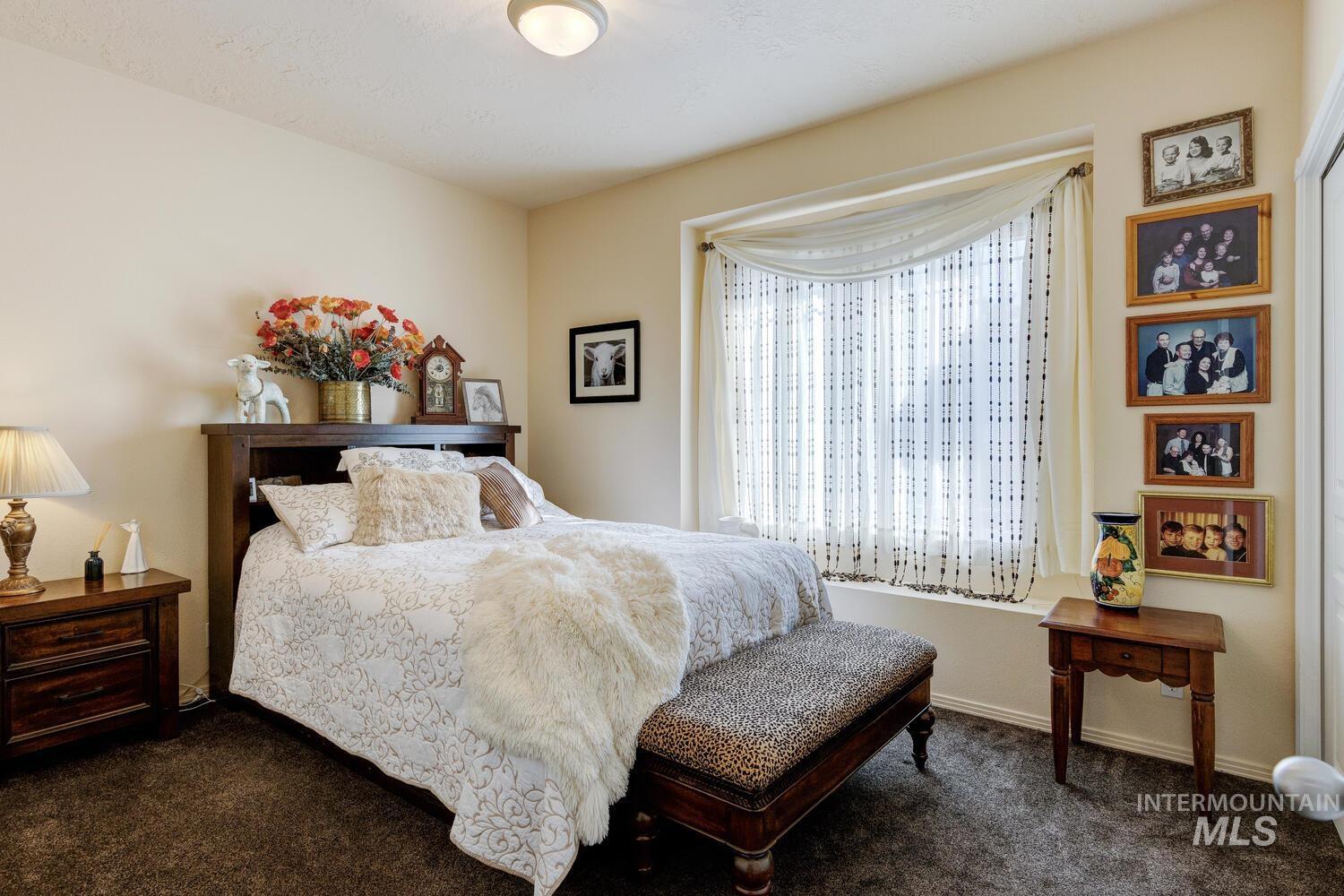 10585 West Vega Court Star, ID 83669 - Photo 23 of 49 Bedroom with dark colored carpet