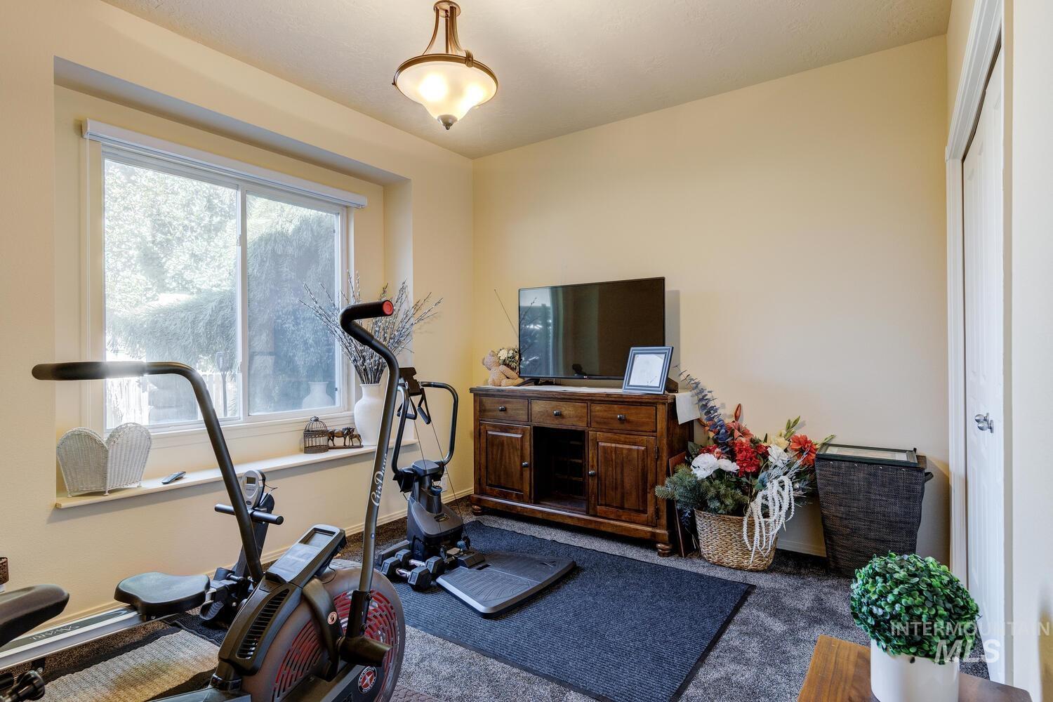 10585 West Vega Court Star, ID 83669 - Photo 25 of 49 Exercise room featuring carpet
