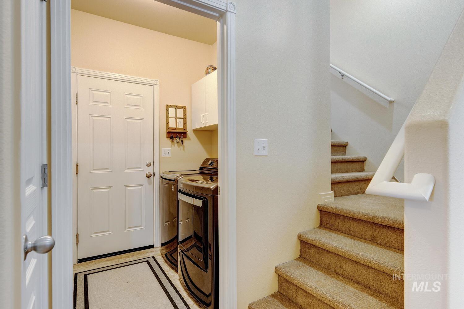 10585 West Vega Court Star, ID 83669 - Photo 29 of 49 Washroom featuring separate washer and dryer and cabinet space