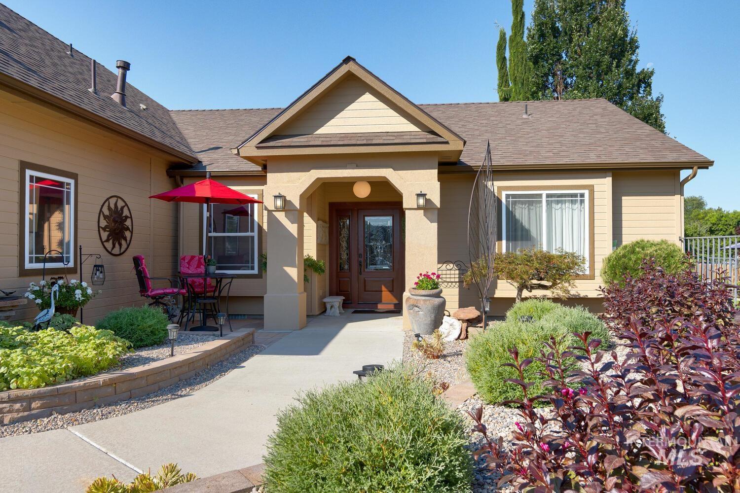 10585 West Vega Court Star, ID 83669 - Photo 3 of 49 Entrance to property featuring a shingled roof