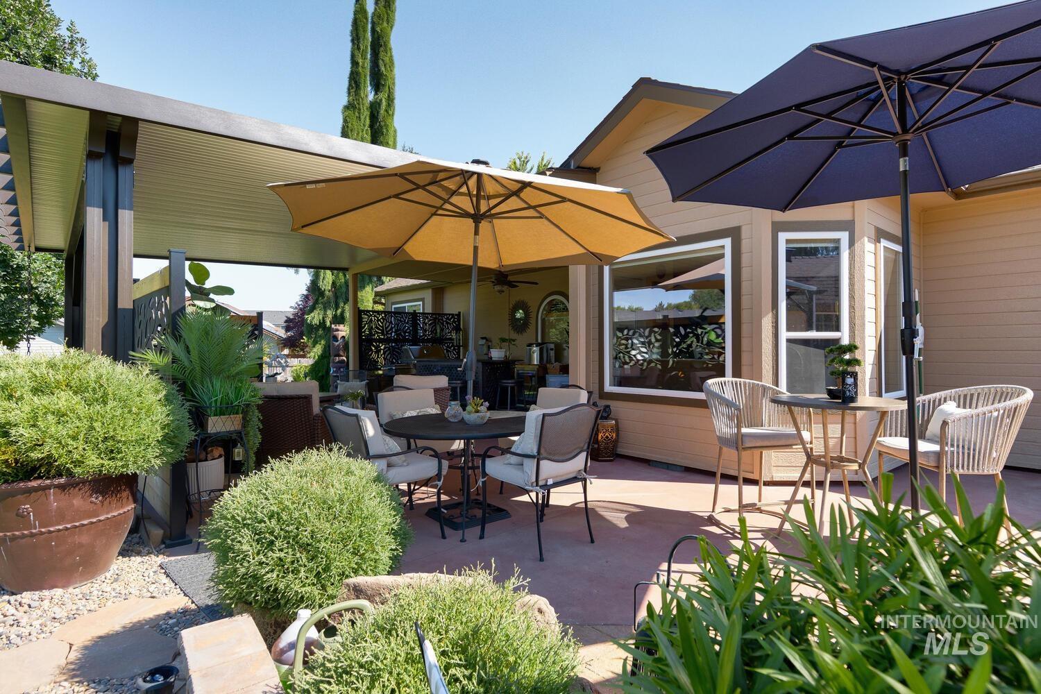 10585 West Vega Court Star, ID 83669 - Photo 34 of 49 View of patio / terrace featuring outdoor dining area and ceiling fan