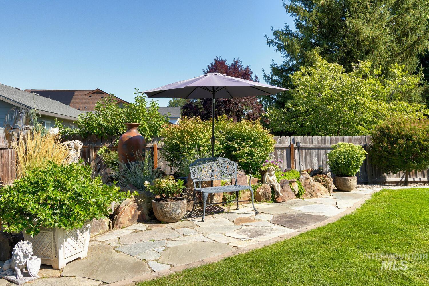 10585 West Vega Court Star, ID 83669 - Photo 44 of 49 Fenced backyard with a patio