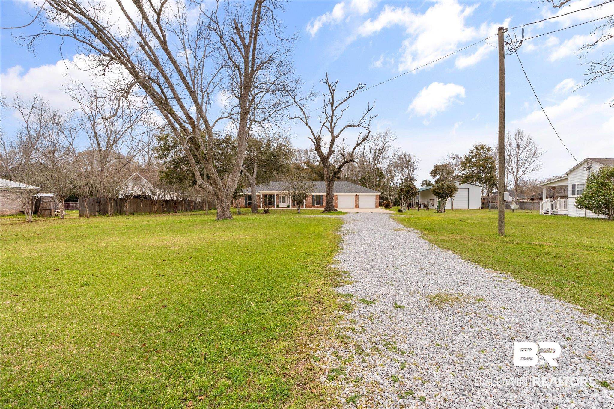 734 West Section Avenue Foley, AL 36535 - Photo 34 of 50 Ranch-style home featuring a front lawn, an attached garage, driveway, and fence