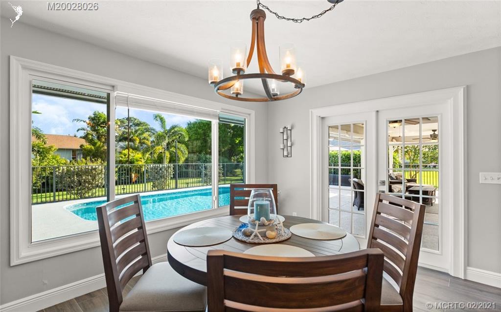 5321 Southeast Sterling Circle Stuart, FL 34997 - Photo 13 of 29 a view of a dining room with furniture window and outside view