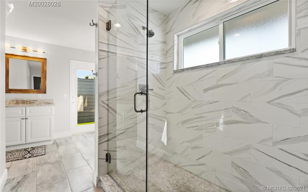 5321 Southeast Sterling Circle Stuart, FL 34997 - Photo 17 of 29 a bathroom with a shower