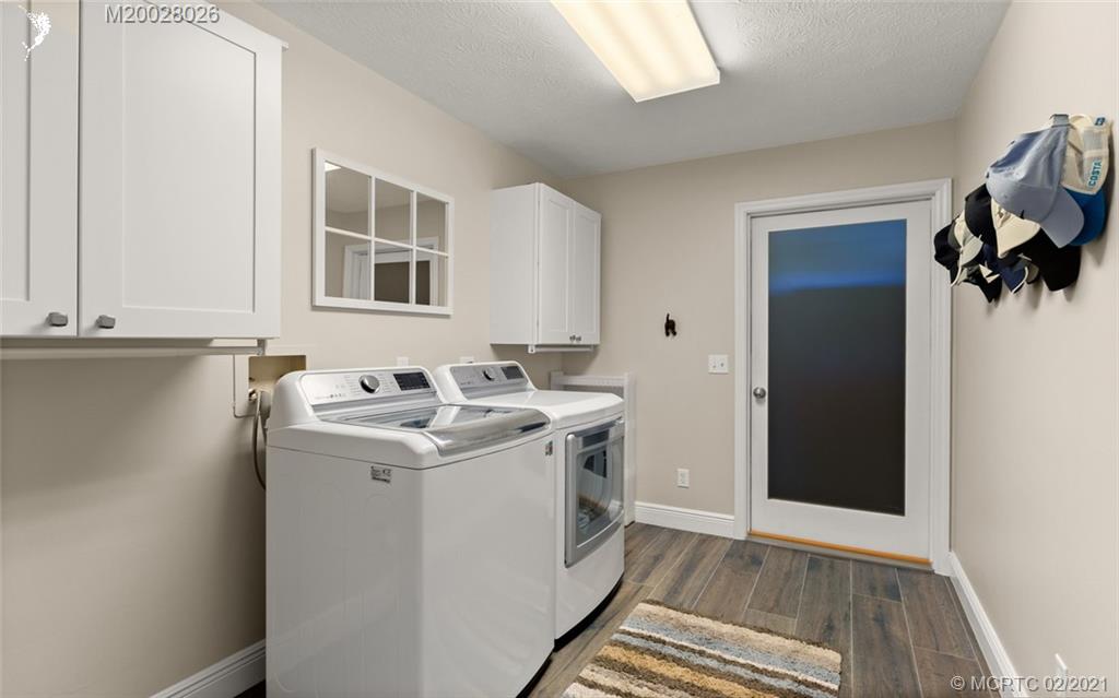 5321 Southeast Sterling Circle Stuart, FL 34997 - Photo 23 of 29 a utility room with washer and dryer