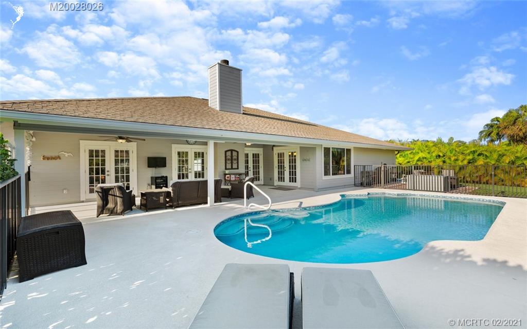 5321 Southeast Sterling Circle Stuart, FL 34997 - Photo 26 of 29 a view of a house with swimming pool and sitting area