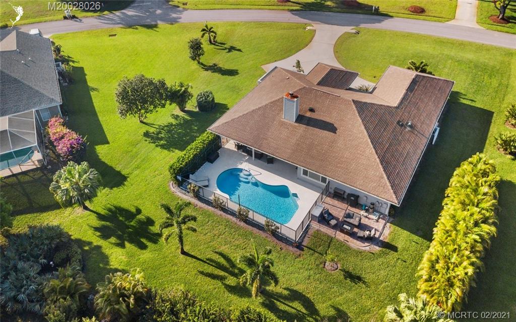 5321 Southeast Sterling Circle Stuart, FL 34997 - Photo 29 of 29 an aerial view of a swimming pool with outdoor seating