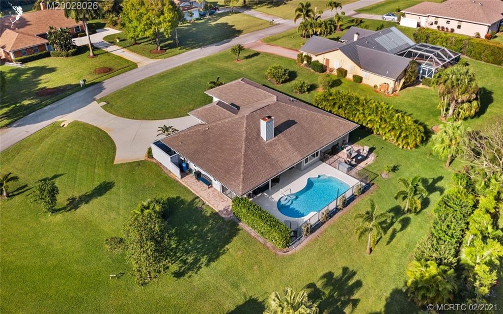 5321 Southeast Sterling Circle Stuart, FL 34997 - Photo 4 of 29 an aerial view of a house with swimming pool yard and outdoor seating
