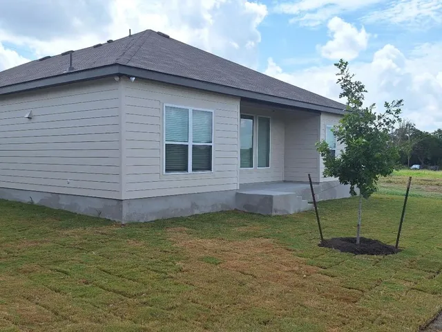 a view of a backyard with a garden