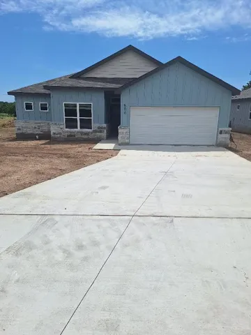 a front view of a house with a garage