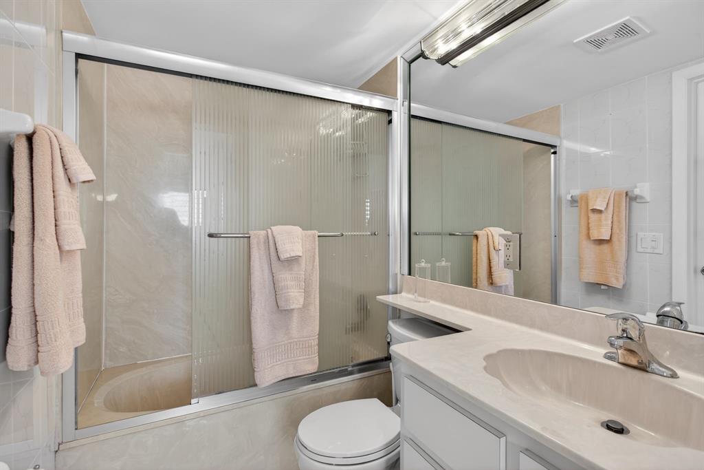 505 North Riverside Drive, Unit 21 Pompano Beach, FL 33062 - Photo 14 of 24 a bathroom with a sink toilet and shower