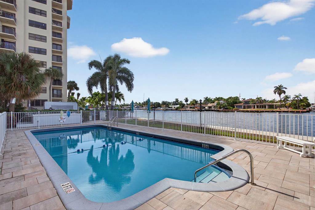 505 North Riverside Drive, Unit 21 Pompano Beach, FL 33062 - Photo 18 of 24 a view of a swimming pool with a lounge chairs