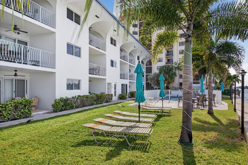 505 North Riverside Drive, Unit 21 Pompano Beach, FL 33062 - Photo 21 of 24 a building view with a garden space