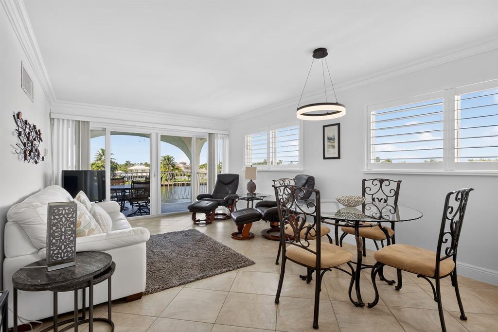 505 North Riverside Drive, Unit 21 Pompano Beach, FL 33062 - Photo 4 of 24 a living room with furniture and a table