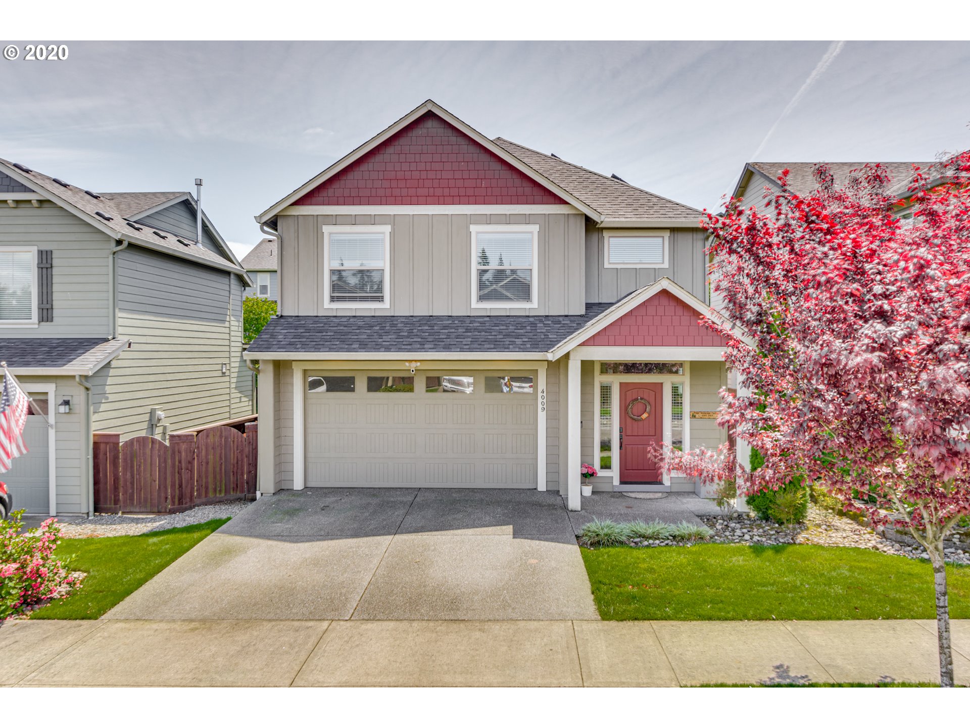 4009 North 5th Way Ridgefield, WA 98642 - Photo 1 of 32 a front view of a house with a yard and garage