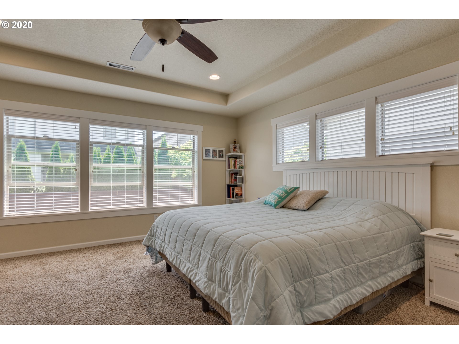 4009 North 5th Way Ridgefield, WA 98642 - Photo 14 of 32 a bedroom with a large bed and a large window