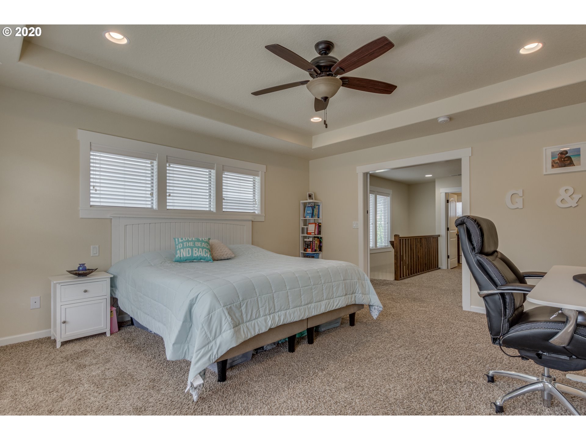 4009 North 5th Way Ridgefield, WA 98642 - Photo 15 of 32 a bedroom with a bed a desk and chair