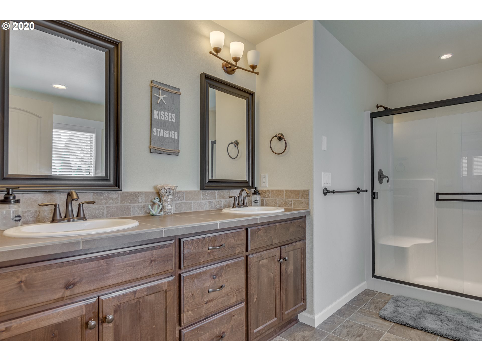 4009 North 5th Way Ridgefield, WA 98642 - Photo 16 of 32 a bathroom with a granite countertop sink mirror and double