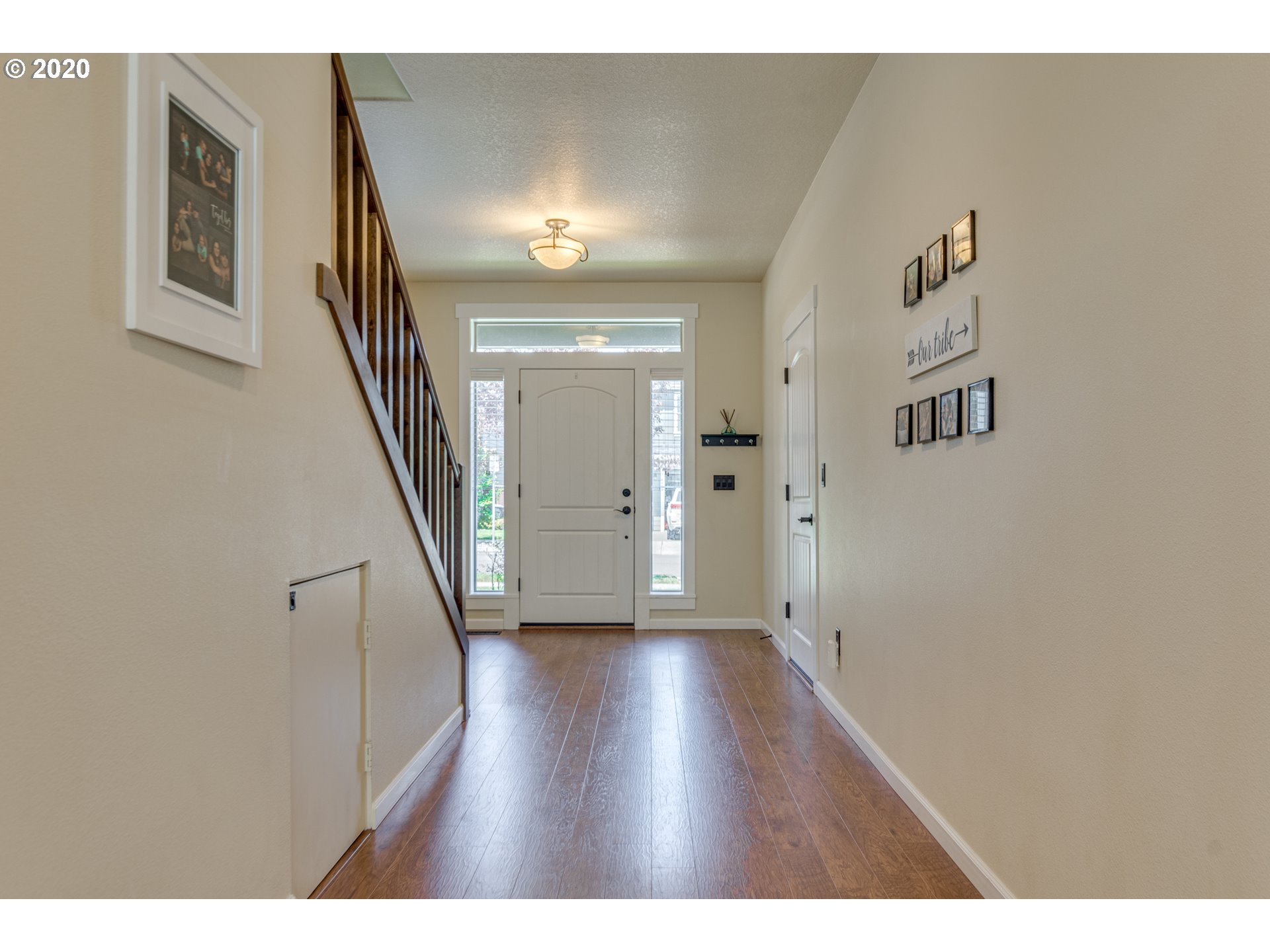 4009 North 5th Way Ridgefield, WA 98642 - Photo 3 of 32 a view of a hallway with wooden floor and staircase