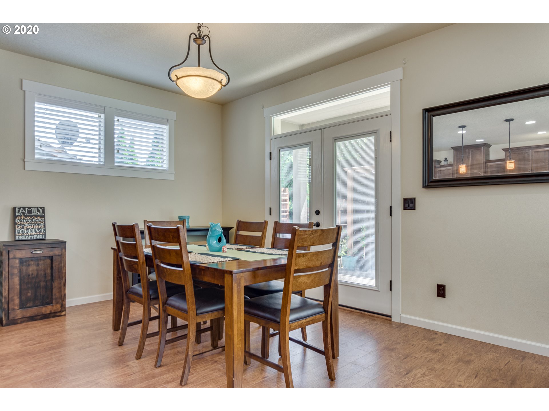 4009 North 5th Way Ridgefield, WA 98642 - Photo 7 of 32 a view of a dining room with furniture and wooden floor