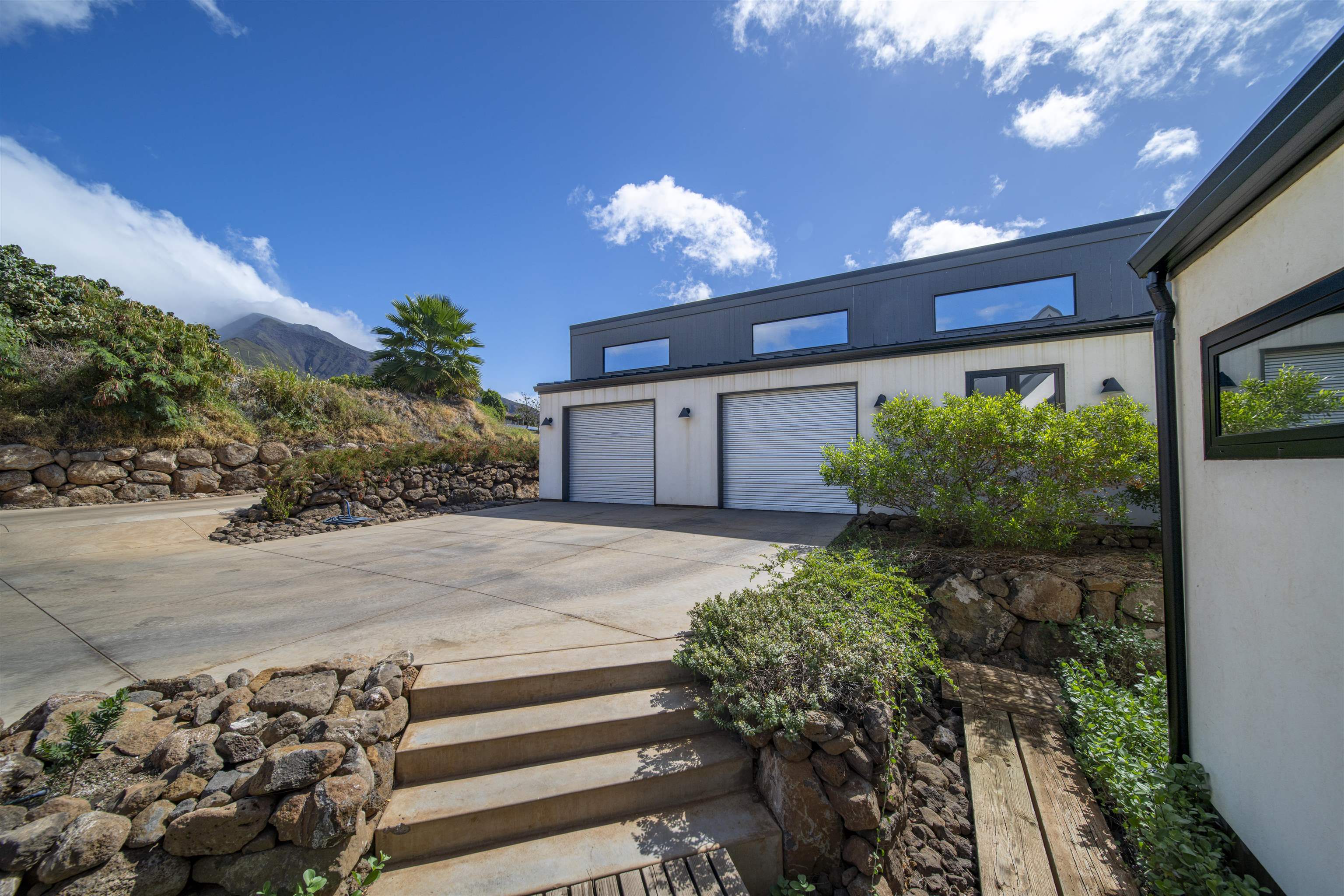 153 Haniu Street, Unit B Lahaina, HI 96761 - Photo 11 of 41 a front view of a house with garden