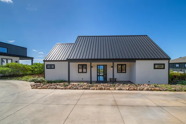 a front view of a house with yard