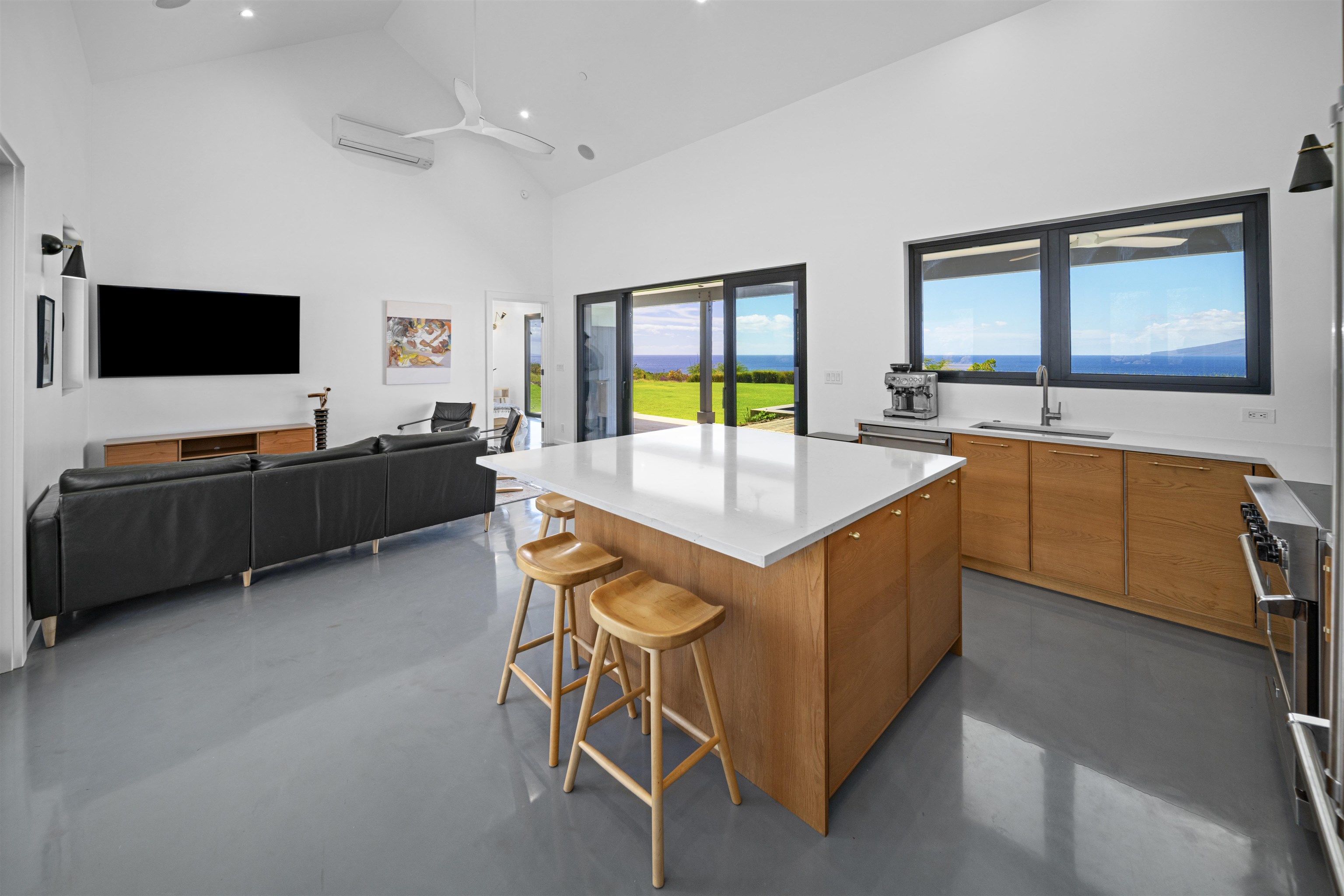 153 Haniu Street, Unit B Lahaina, HI 96761 - Photo 17 of 41 a room with furniture and flat screen tv