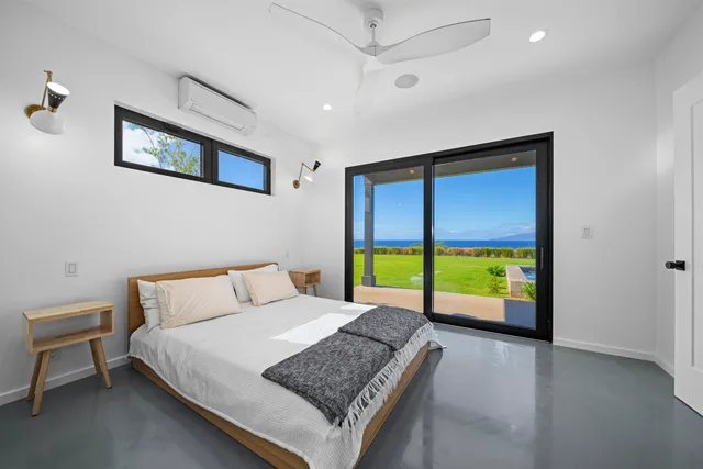 a bathroom with a sink a mirror and a large window