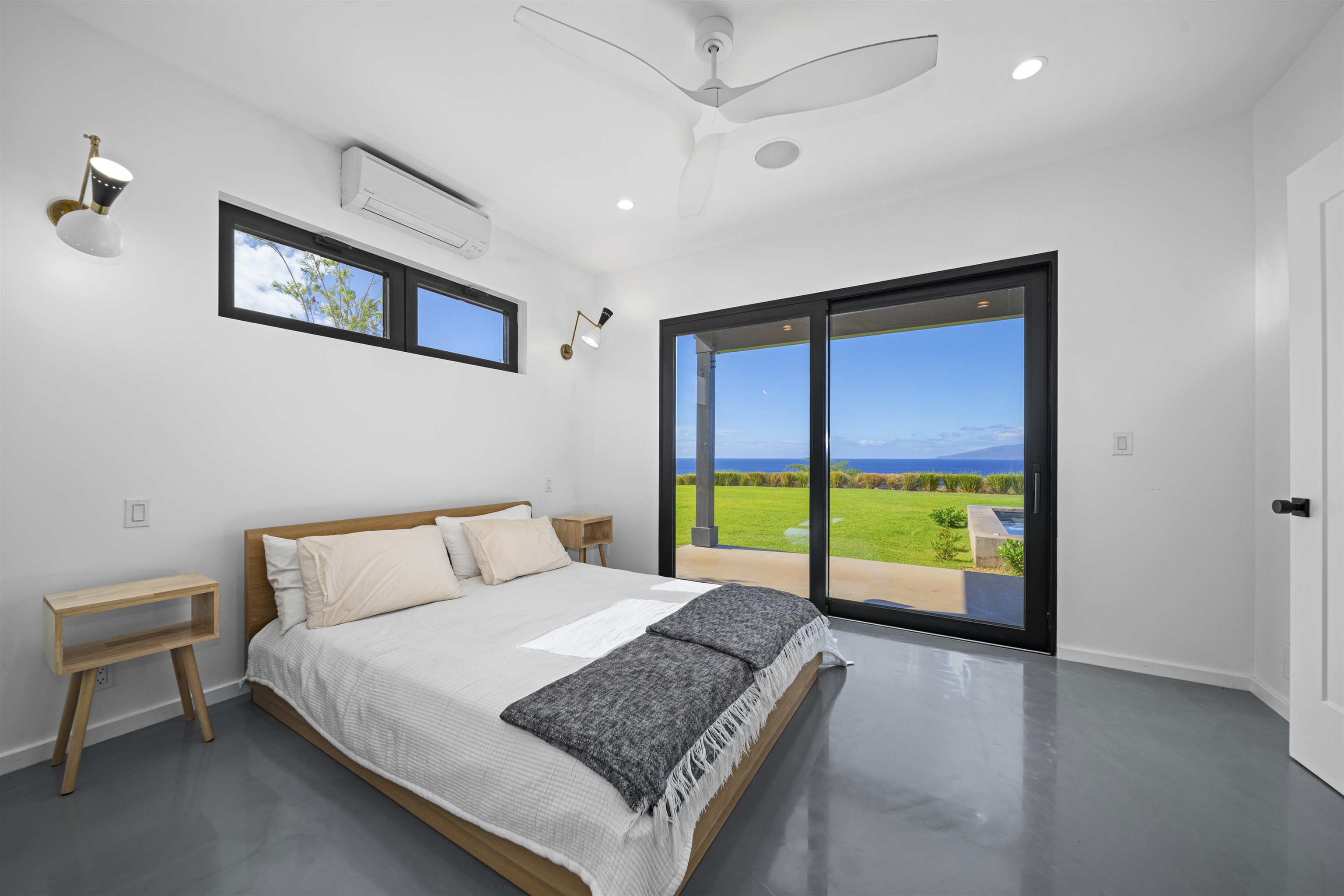 153 Haniu Street, Unit B Lahaina, HI 96761 - Photo 19 of 41 a bed sitting in a bedroom next to a window