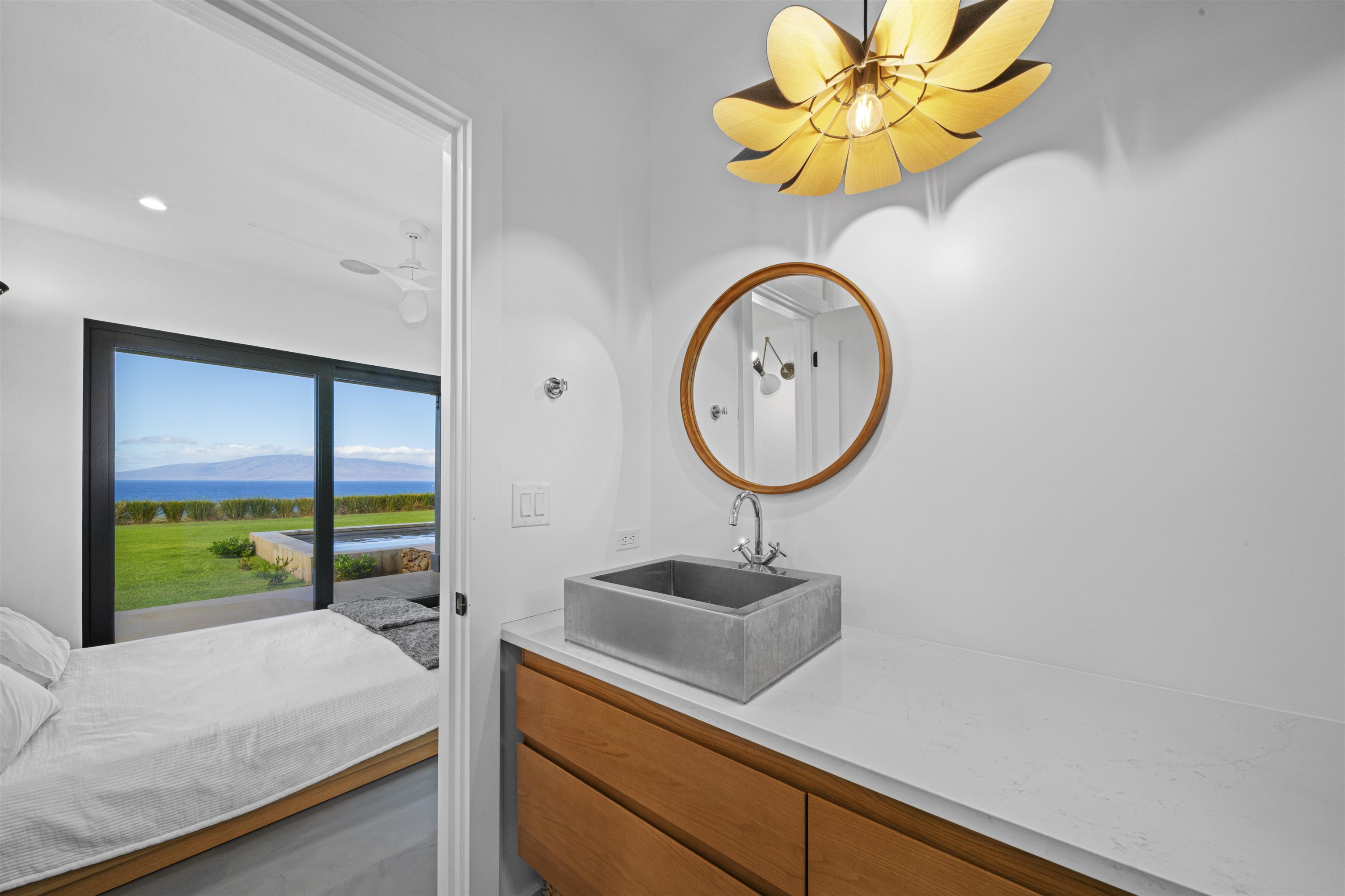 153 Haniu Street, Unit B Lahaina, HI 96761 - Photo 20 of 41 a bathroom with a sink a mirror and a large window