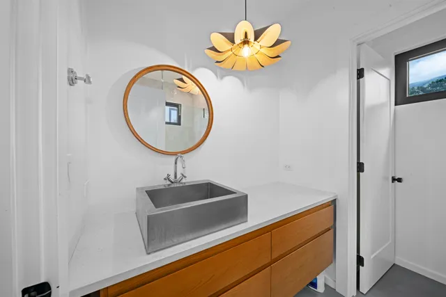 a bathroom with a tub and a mirror